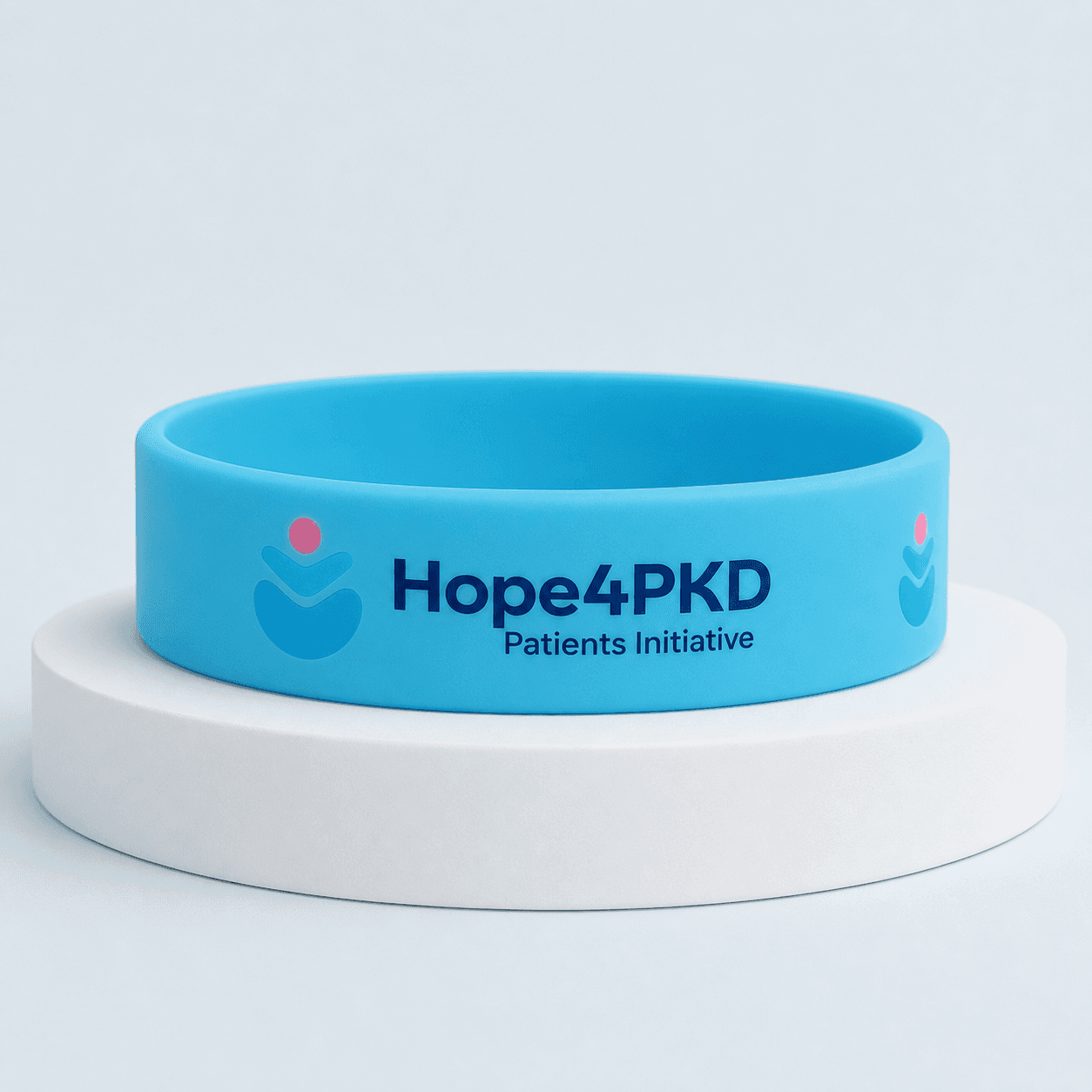 Mock-up of a blue silicone wristband carrying the Hope4PKD logo and wordmark.